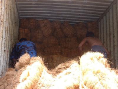 Loading of bristle fibre container